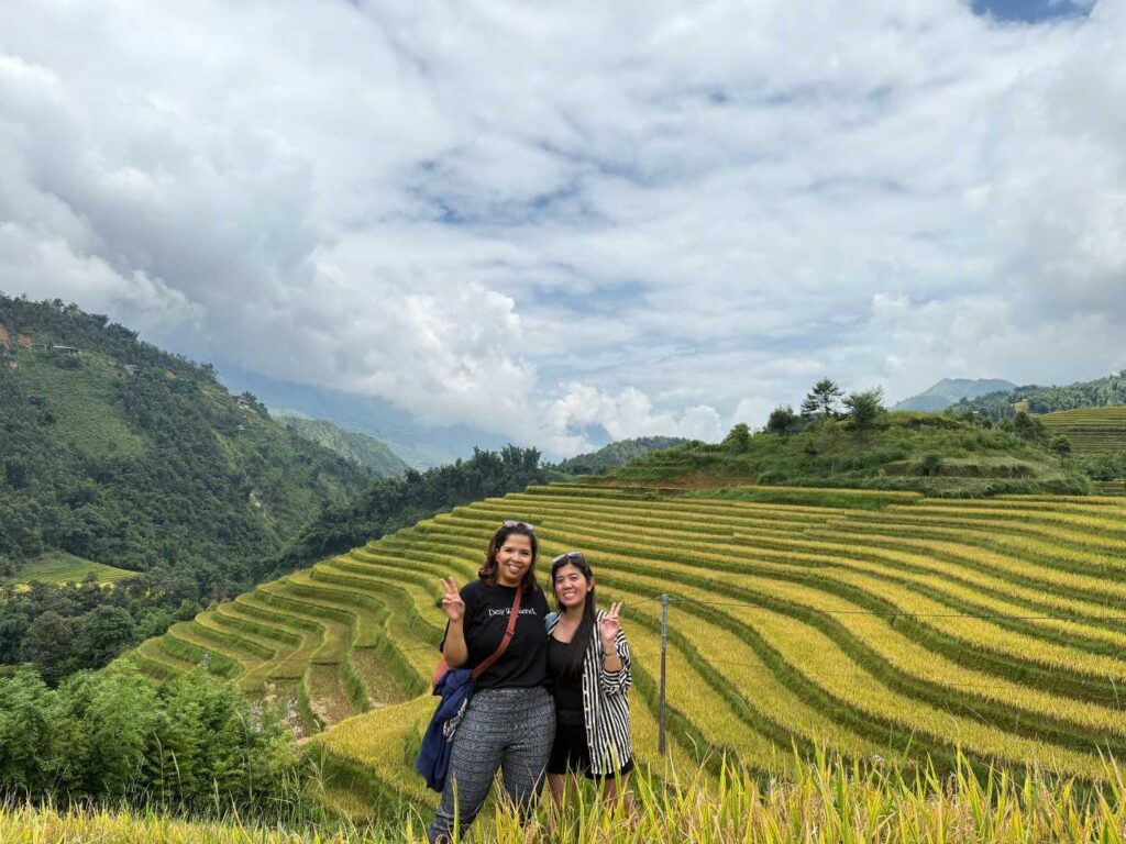 two tourist trekking in the rice fields