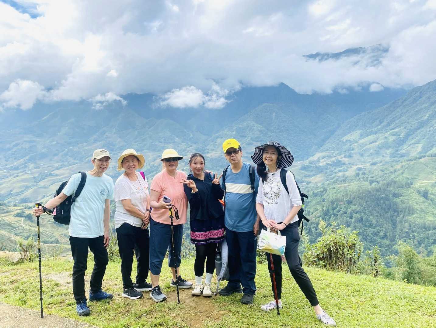 a group trekking ion sapa with local guide