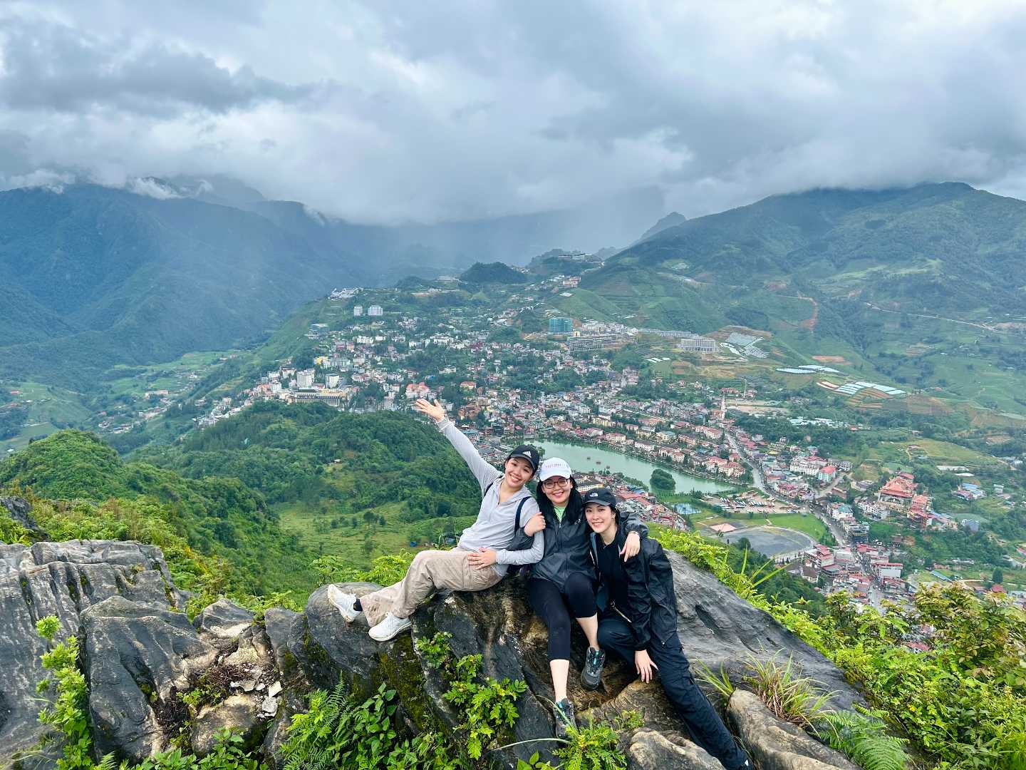 three travelers on a Sapa 2-day 1-night adventure trekking tour through mountain