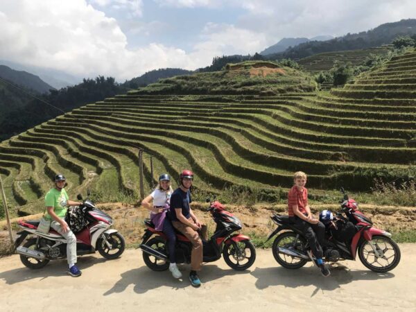 family riding motorbike in sapa