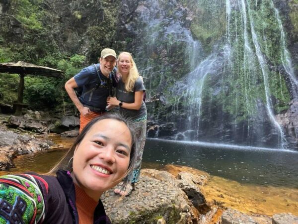 hmong guide and tourist in love waterfall